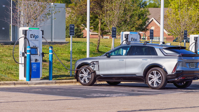 Cadillac LYRIQ electric car at EVgo fast charging station.