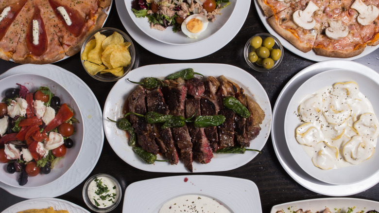 An overhead photo of many different Spanish tapas foods,