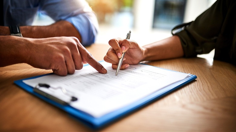 Two people going over paperwork
