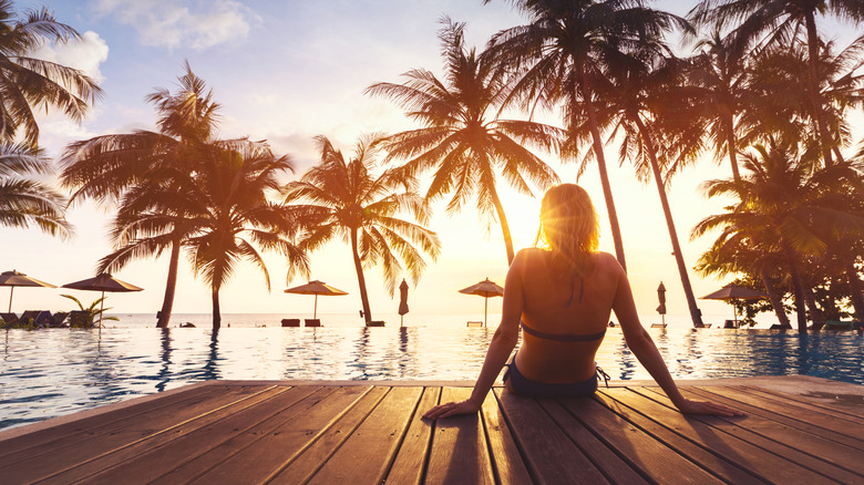 Person lounging on resort deck
