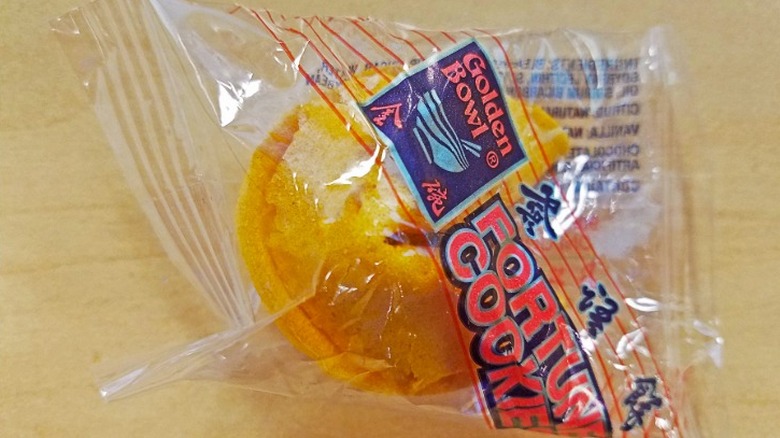 A fortune cookie from Golden Bowl still in its wrapper.