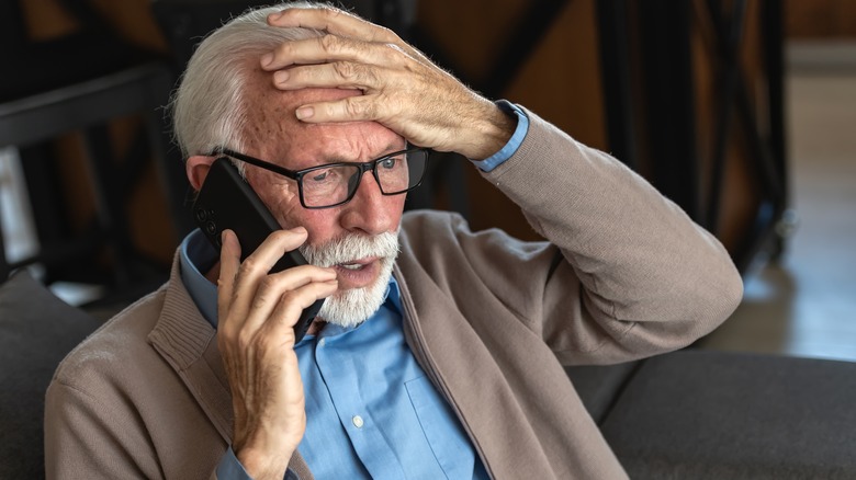 Upset older man on the phone