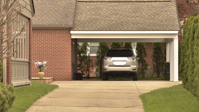 A car parked under a home carport