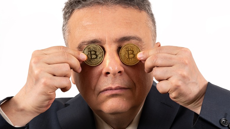 Man hides behind crypto coins