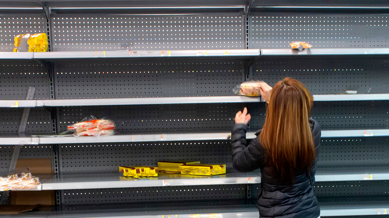 Person shopping empty shelves
