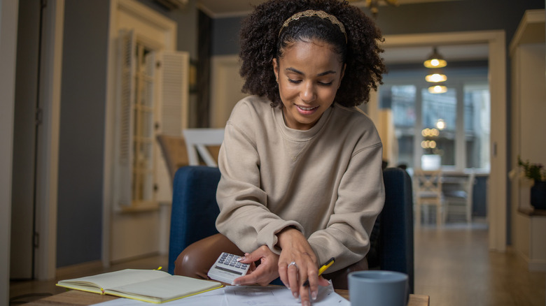 Woman budgeting at home