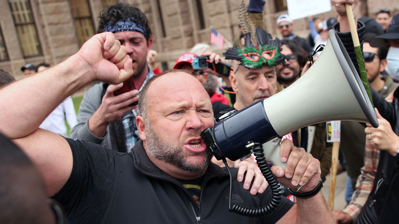 Radio host Alex Jones shouts into megaphone