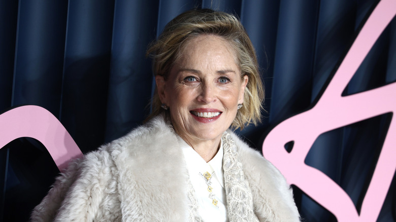 Close-up image of actress Sharon Stone smiling in fur coat