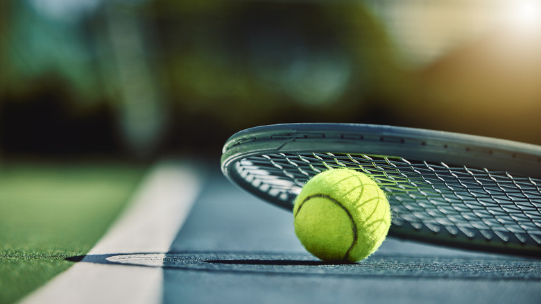 closeup of tennos ball and racket