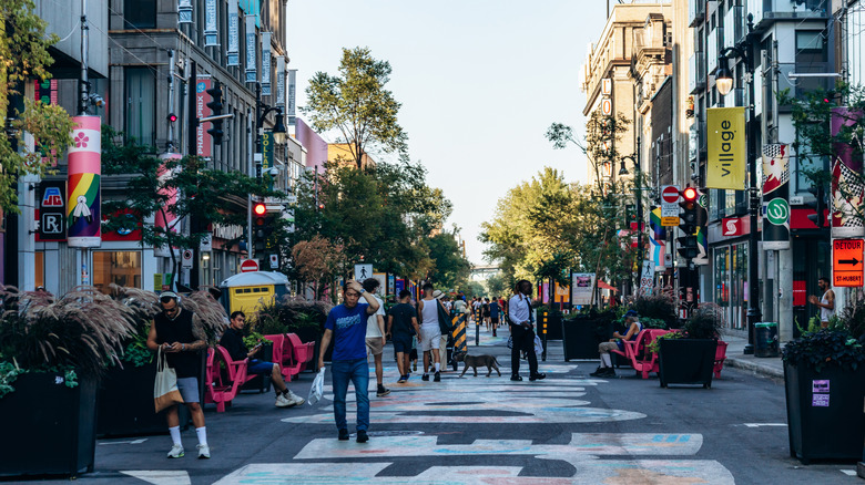 People walking through a city street.