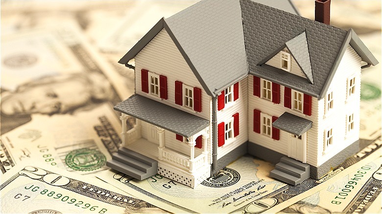 House model atop US currency