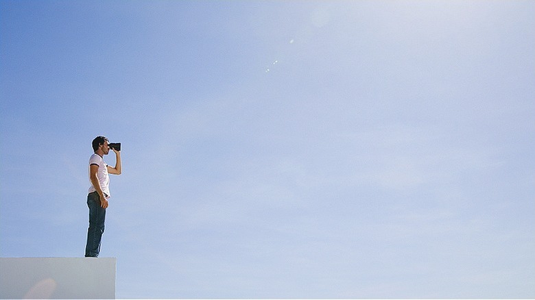 Person looking from afar