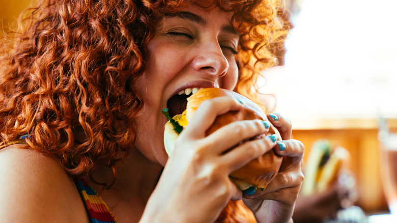 Young people having food at a fast food restaurant