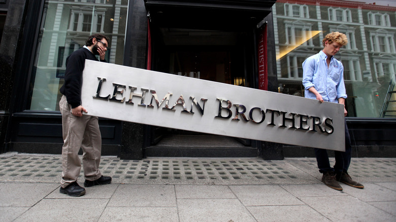 Men carrying Lehman Brothers sign