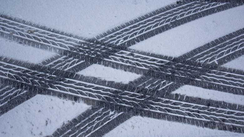 Overlapping tire tracks in fresh snow
