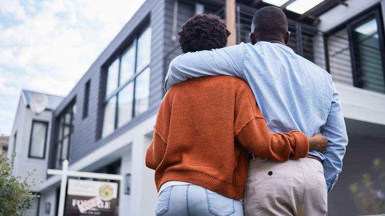 Young couple looking at home