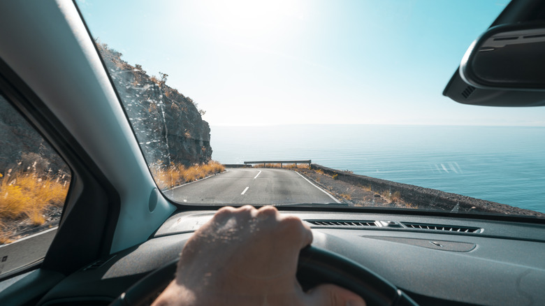 Person driving on an open road