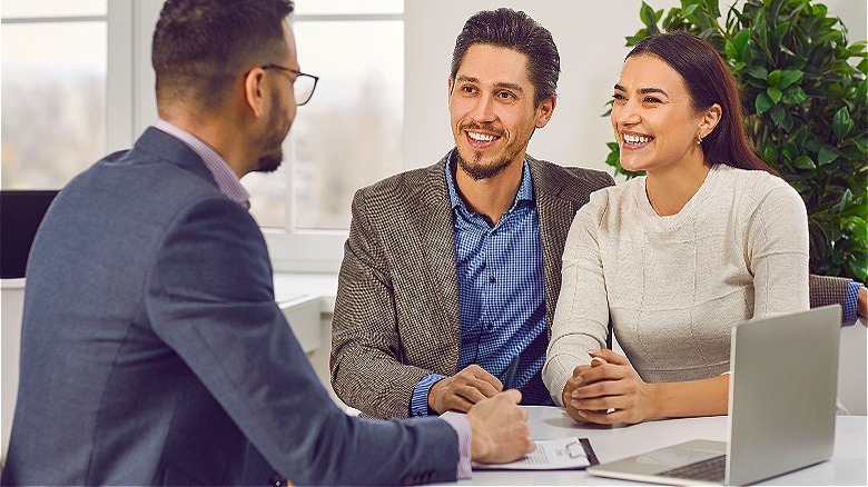 Couple meeting with financial adviser