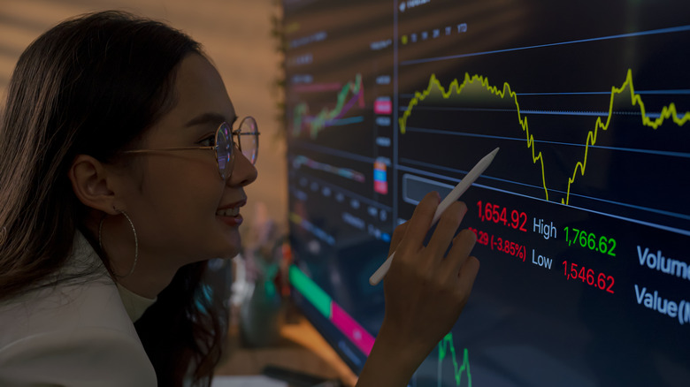 Woman reading financial chart