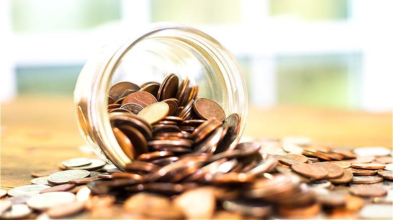 Pennies spilled from jar