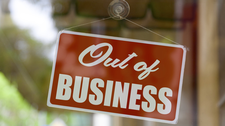 an out of business sign in window