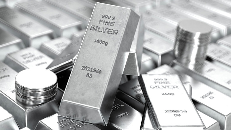 Stacks of silver bars and coins