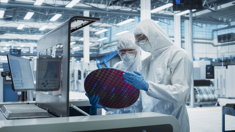 Engineers manufacturing a semiconductor