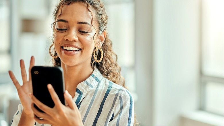 Girl smiling on her phone