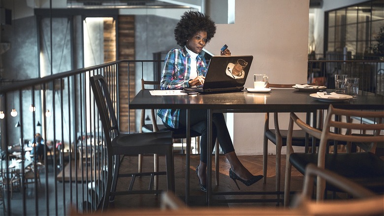 Business person working at cafe table