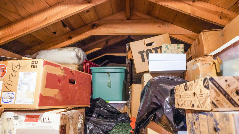 Cluttered attic full of boxes and other containers