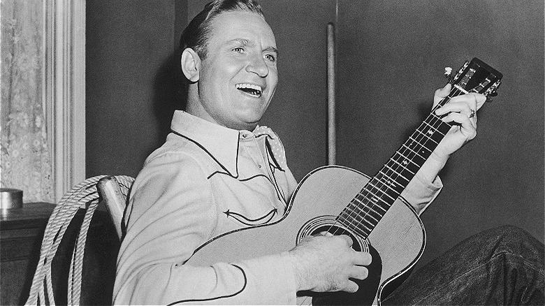Gene Autry plays guitar