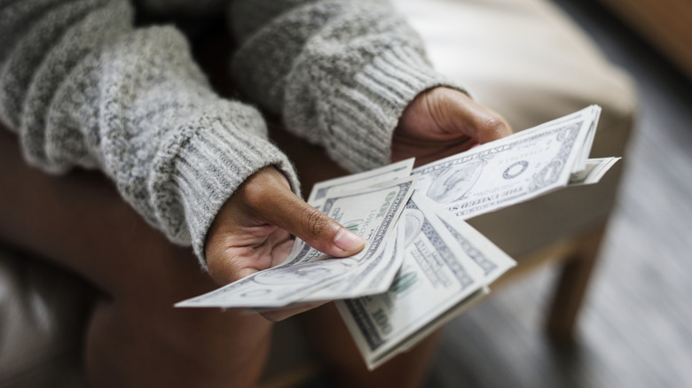 women counting money