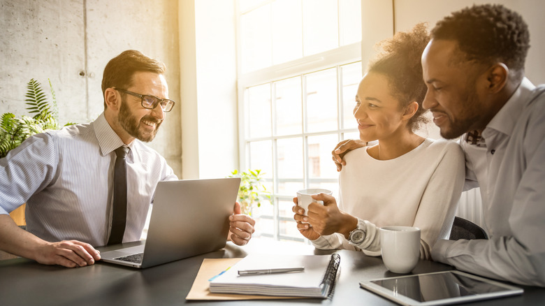 An accountant discussing financial strategies with a young couple