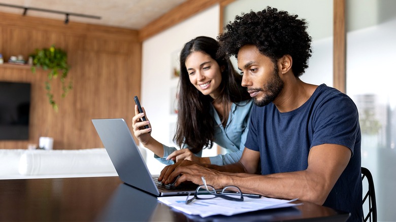 Couple preparing taxes at home