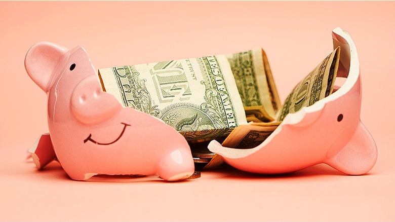 piggy bank with money broken