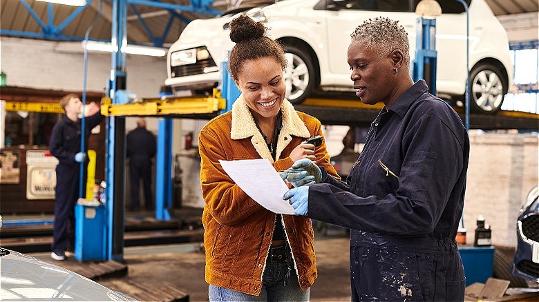 Mechanic discussing repair with customer