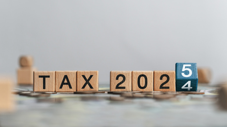 Tax 2025 concept with wooden blocks and letters