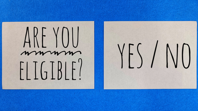 Are You Eligible? Yes or No decision concept on paper cards with blue background