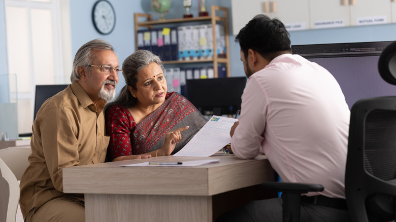 An older couple making plans with a financial advisor