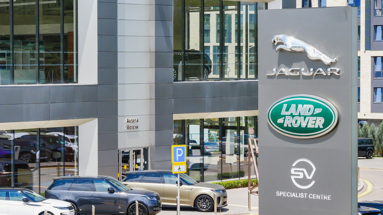 Jaguar Land Rover Logo in front of a dealshirp