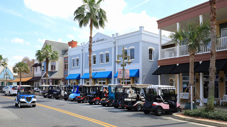 Golf carts parked on a street in The Villages, Sumter County, Florida