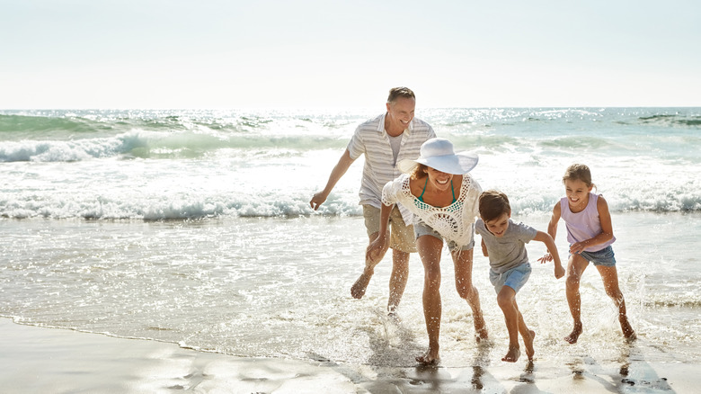 Family playing on a beach in Florida
