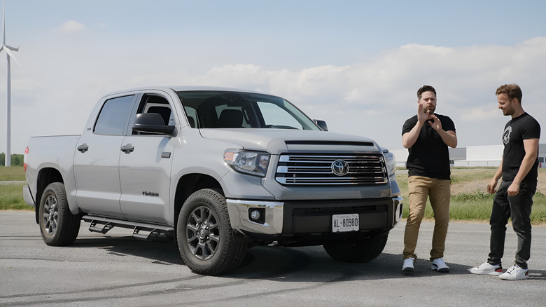 The 2021 Toyota Tundra in a car park while the team at Extra Throttle House review it.