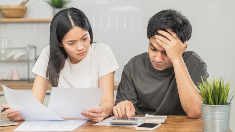 Couple evaluating their debts