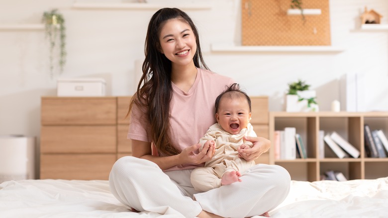Woman holding a baby