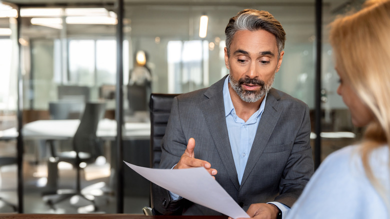 lawyer explaining a document to a client