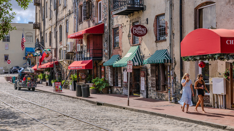 People waling around Riverstreet waterfront in Savannah Georgia