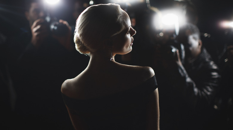 Woman posing for paparazzi