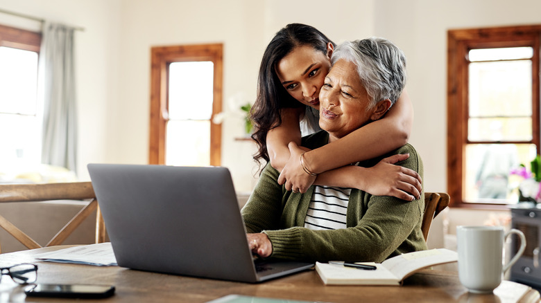 Mother and daughter duo on laptop