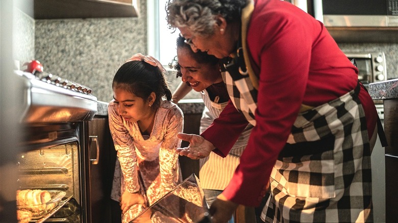 Three generations baking in kitchen